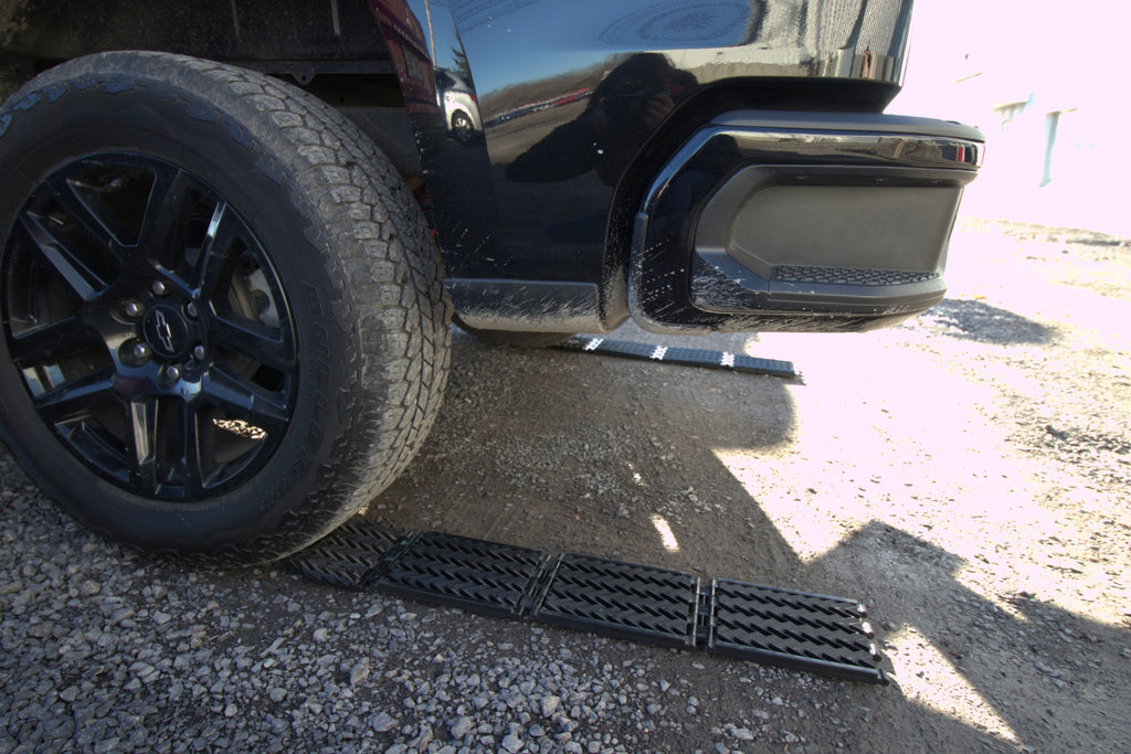 Niveleur et aide-traction