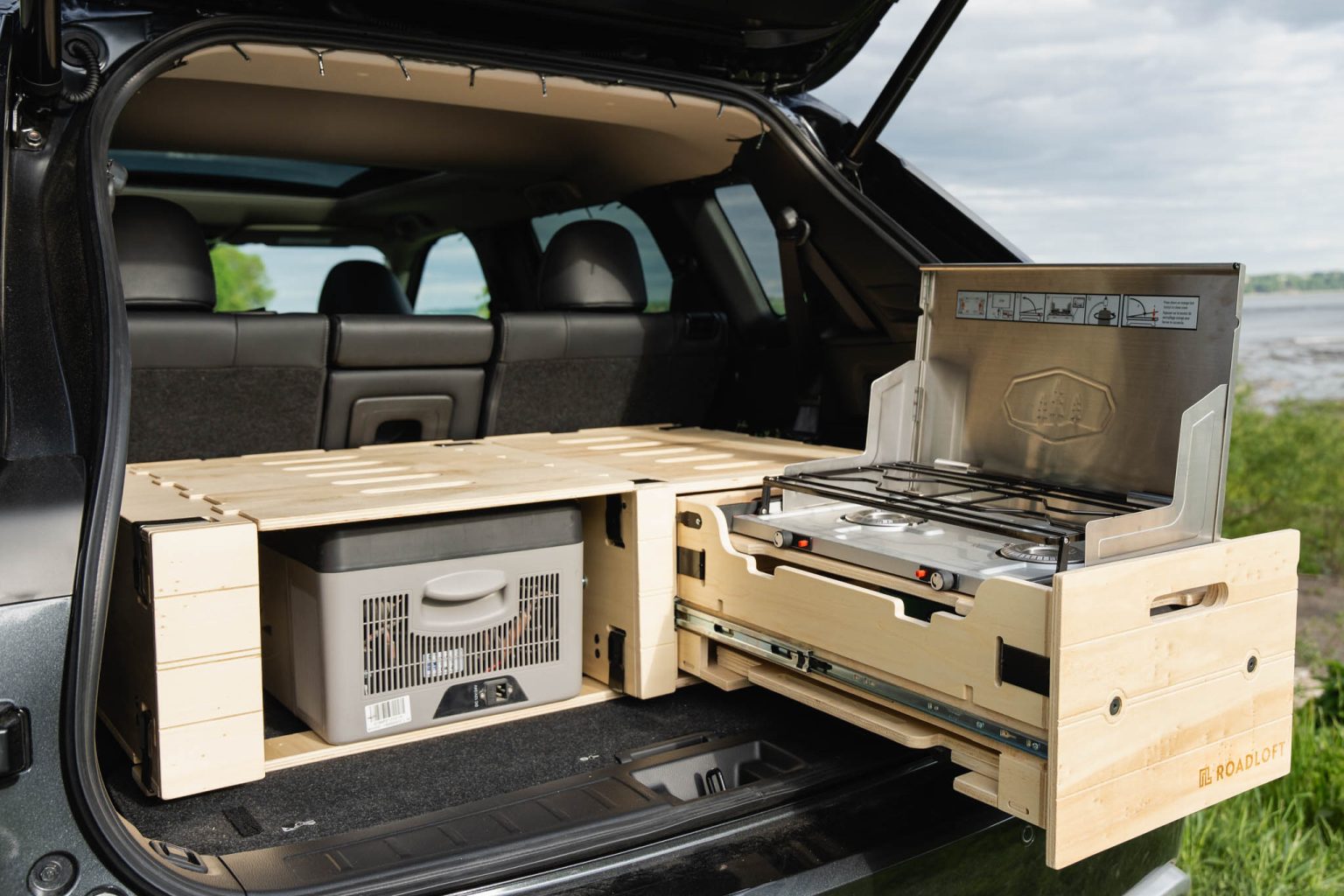 Comfortable sleeping space for two in the Roadloft camper kit, designed for restful nights on the road.