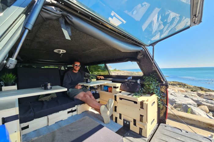 Roadloft camper kit with a functional workspace table, perfect for working, reading, or planning trips.