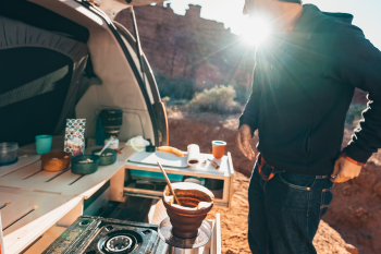 Compact and functional Roadloft camper kitchen featuring ergonomic surfaces, a retractable sink, and smart storage solutions.