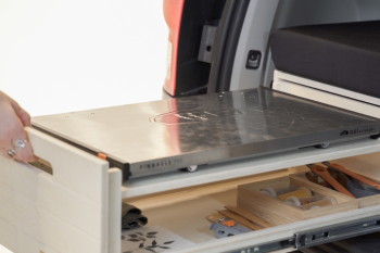 Adjustable-height drawer in the Roadloft minivan kit, designed to fit various portable burners.