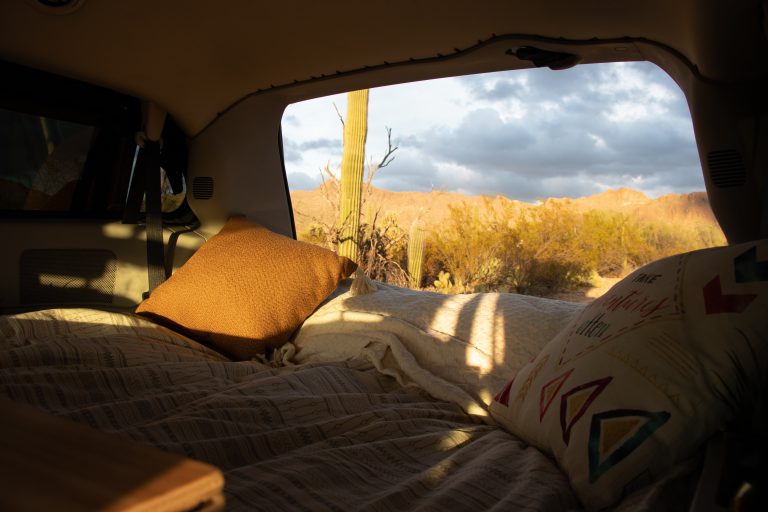 Cozy vanlife setup with the Roadloft camper kit, providing comfort and warmth for off-grid living.