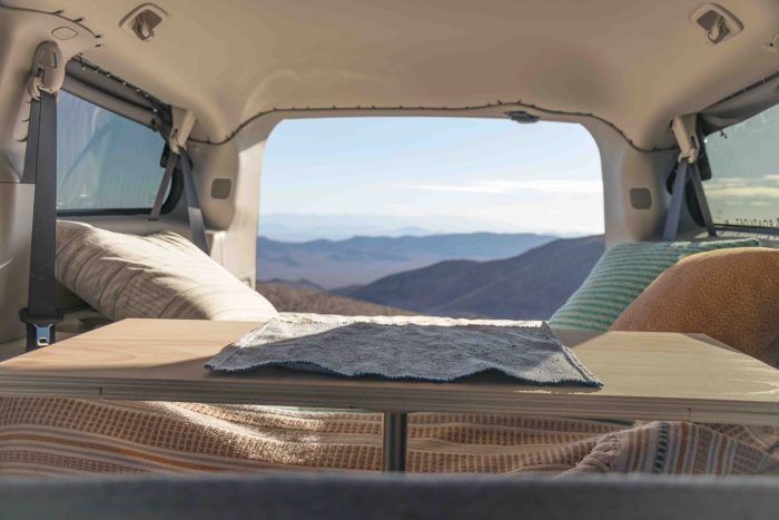 Interior of a minivan transformed with Roadloft kit, featuring stylish and practical design elements for vanlife.