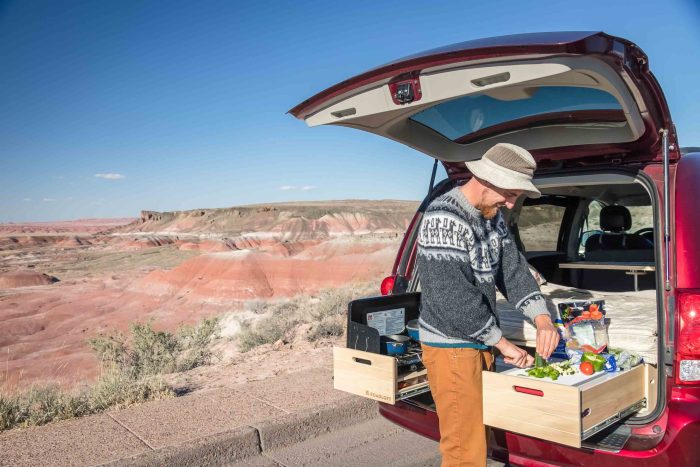 Roadloft camper kit featuring a complete camp kitchen with essential cooking tools and smart storage.